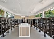 Thumbnail 15 of 29 - A room full of black mailboxes with one open.