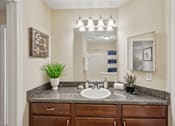 Thumbnail 2 of 32 - Bathroom with sink at Radbourne Lake Apartments, North Carolina