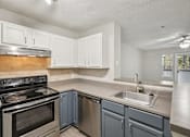 Thumbnail 6 of 32 - Modern Kitchen at Radbourne Lake Apartments, Charlotte, NC 28269