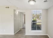 Thumbnail 17 of 31 - A room with a window and a door at Keller Oaks, Carrollton, 75006