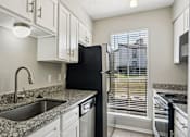 Thumbnail 15 of 31 - Kitchen with sink at Keller Oaks, Carrollton, 75006