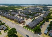 Thumbnail 18 of 37 - an aerial view of a neighborhood with rows of houses