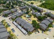 Thumbnail 16 of 37 - arial view of a neighborhood of houses with a basketball court