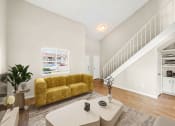 Thumbnail 7 of 16 - a living room with a couch and a table at The Hudson, Carrollton, TX ?