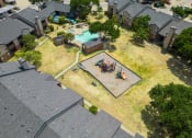 Thumbnail 15 of 37 - arial view of a home with a swimming pool and backyard