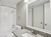 Thumbnail 19 of 31 - Bathroom with large mirror at Keller Oaks, Carrollton, TX 75006