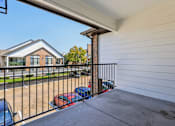 Thumbnail 44 of 54 - A black metal fence with a red car and a blue car behind it.