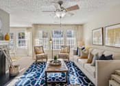 Thumbnail 17 of 32 - Living room with couch at Radbourne Lake Apartments, Charlotte, North Carolina