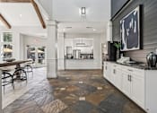 Thumbnail 15 of 54 - A kitchen with a black and white checkered floor.