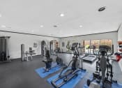 Thumbnail 8 of 37 - a gym with treadmills and other exercise equipment