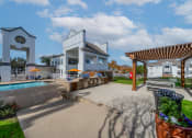 Thumbnail 10 of 37 - a patio with a pool and a building with a clock on the side