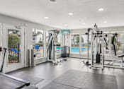 Thumbnail 23 of 31 - Well-equipped gym at Keller Oaks, Carrollton, TX