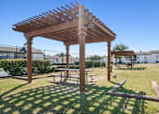 Thumbnail 27 of 31 - Wooden pergola with bench at Keller Oaks, Carrollton, Texas
