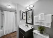 Thumbnail 25 of 37 - a bathroom with a sink toilet and shower