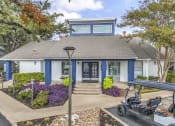 Thumbnail 34 of 41 - a blue house with a golf cart parked in front of it