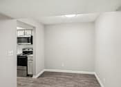 Thumbnail 9 of 35 - A kitchen area with a dishwasher and oven.