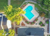 Thumbnail 9 of 21 - arial view of a pool in a backyard with trees
