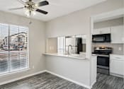 Thumbnail 13 of 31 - Room with ceiling fan at Keller Oaks, Carrollton, TX 75006