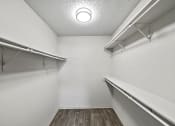Thumbnail 34 of 37 - a spacious walk in closet at the oxford at estonia apartments in san antonio