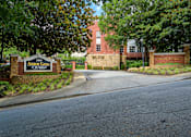 Thumbnail 31 of 80 - The entrance to Arbor Gates at Richfield is surrounded by trees.