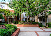 Thumbnail 46 of 80 - A brick pathway leads to a building entrance.