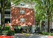 Thumbnail 48 of 80 - A red brick building with a yellow line on the ground in front of it.