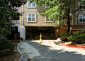 Thumbnail 49 of 80 - A brown building with a black gate and a yellow post in front.