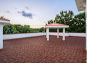 Thumbnail 57 of 80 - A gazebo sits on a red brick patio.