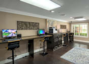 Thumbnail 66 of 80 - A room with a desk, computer, and chair.