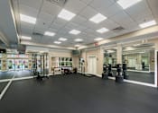 Thumbnail 73 of 80 - A gym with a black floor and white walls.