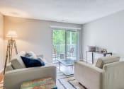 Thumbnail 14 of 32 - a living room with a couch and a chair and a sliding glass door aat The Grove Brentwood, Nashville Tennessee?