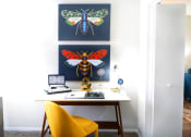 Thumbnail 11 of 20 - a home office with a desk and two paintings of bees and flies at Keller Oaks, Carrollton, 75006 ?