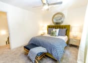 Thumbnail 9 of 30 - a bedroom with a bed and a ceiling fan