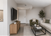 Thumbnail 10 of 15 - A modern living room with a white couch, a black coffee table, and a flat-screen TV.