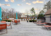 Thumbnail 6 of 32 - an outdoor deck with tables and chairs and umbrellas at The Grove Brentwood, Nashville Tennessee?