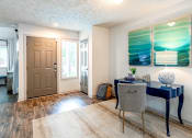 Thumbnail 6 of 30 - a home office with a desk and chair and a door