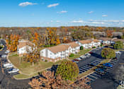 Thumbnail 25 of 32 - A parking lot with cars and apartment buildings in the background at The Grove Brentwood, Nashville, TN 37211 