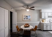 Thumbnail 31 of 32 - A dining room with a table set for two and a ceiling fan. at The Grove Brentwood, Nashville, TN 37211 