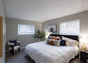 Thumbnail 21 of 32 - A bedroom with a large bed and a chair. at The Grove Brentwood, Nashville, TN 37211 