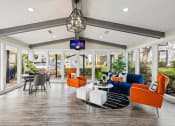 Thumbnail 1 of 20 - the preserve at ballantyne commons clubhouse with couches and a table and chairs at Keller Oaks, Carrollton Texas?