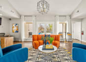 Thumbnail 1 of 16 - a living room with blue and orange furniture and a table at The Hudson, Carrollton, 75006 ?