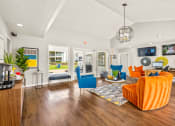 Thumbnail 2 of 16 - the living room of a house with furniture and a fireplace at The Hudson, Carrollton, TX ?
