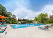 Thumbnail 12 of 32 - resort-inspired pool with lounge chairs