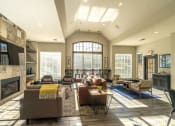 Thumbnail 8 of 23 - a living room with couches and chairs and a fireplace at Radbourne Lake Apartments, Charlotte, NC ?