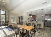 Thumbnail 22 of 23 - a dining room and kitchen with a table and chairs at Radbourne Lake Apartments, Charlotte, NC ?