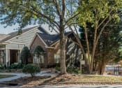 Thumbnail 12 of 23 - an apartment building with a yard and trees in front of it at Radbourne Lake Apartments, North Carolina ?
