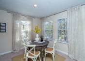 Thumbnail 2 of 23 - a dining room with a table and chairs and windows at Radbourne Lake Apartments, Charlotte, 28269 ?