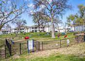 Thumbnail 13 of 17 - A sign in a fenced area with a red mailbox and a blue signboard.