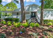 Thumbnail 5 of 27 - a house with a large tree in front of it