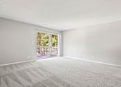 Thumbnail 21 of 27 - a bedroom with a sliding glass door leading to a balcony